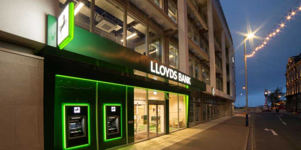 Lloyds Bank signage illuminated at night
